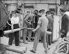 Storing_4-inch_ammunition_on_HMS_Widgeon_1943_IWM_A_18542.jpg