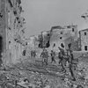 'A' Company, 2nd Battalion, The Lancashire Fusiliers, advancing through Aquino, Italy, May 1944..jpg