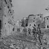 'A' Company, 2nd Battalion, The Lancashire Fusiliers, advancing through Aquino, Italy, May 1944..jpg